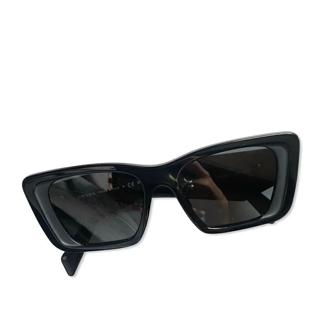 Prada Eyewear black square frame sunglasses logo sides Revolve in case $489